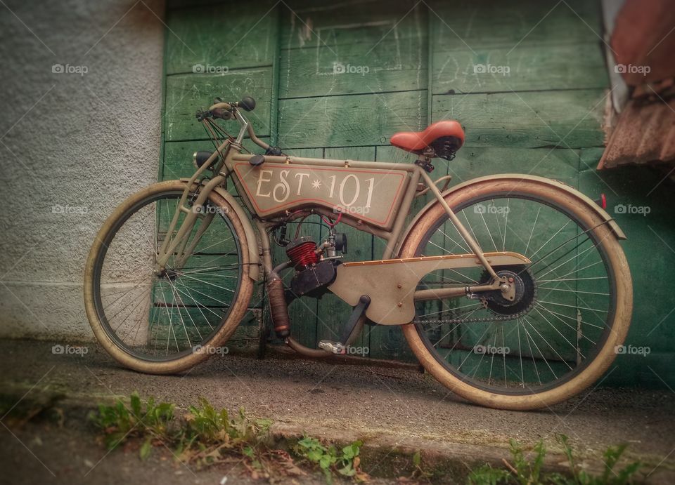 Brasov,Romania. Vintage motorcycle hidden in Old Transilvanian streets