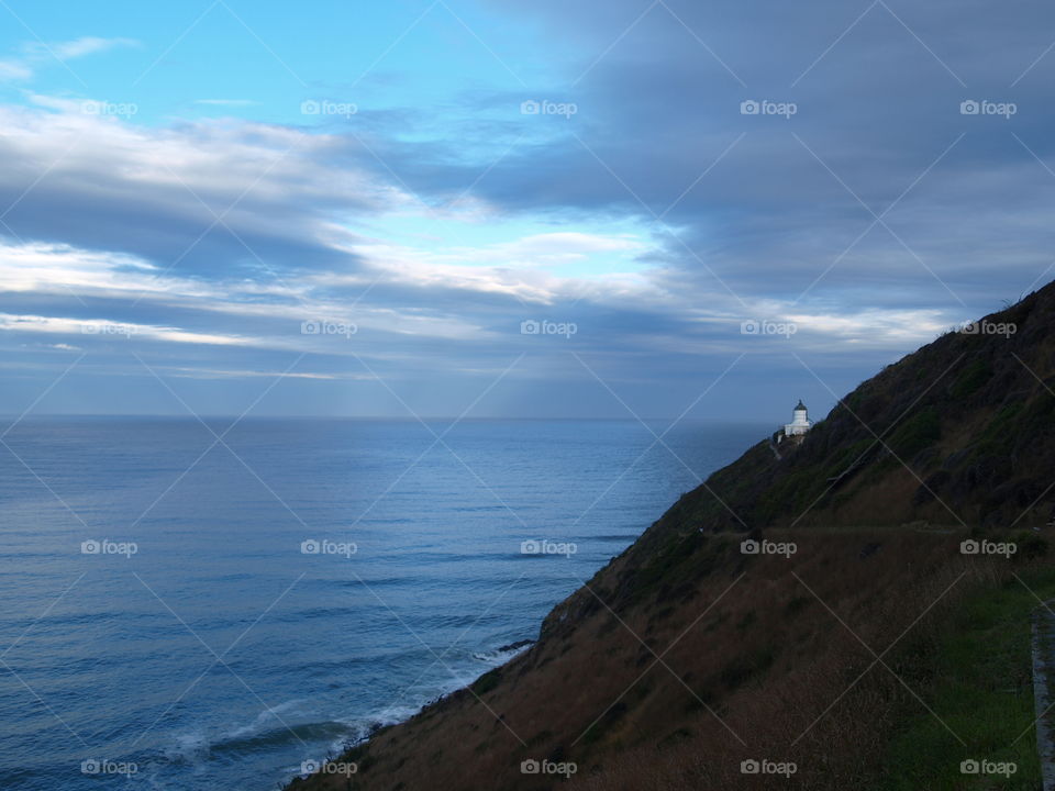 stormy clouds over a lighthouse in new Zealand