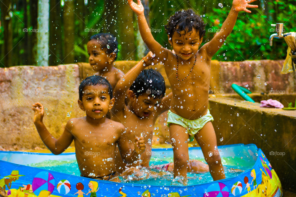 Childrens playing in water.