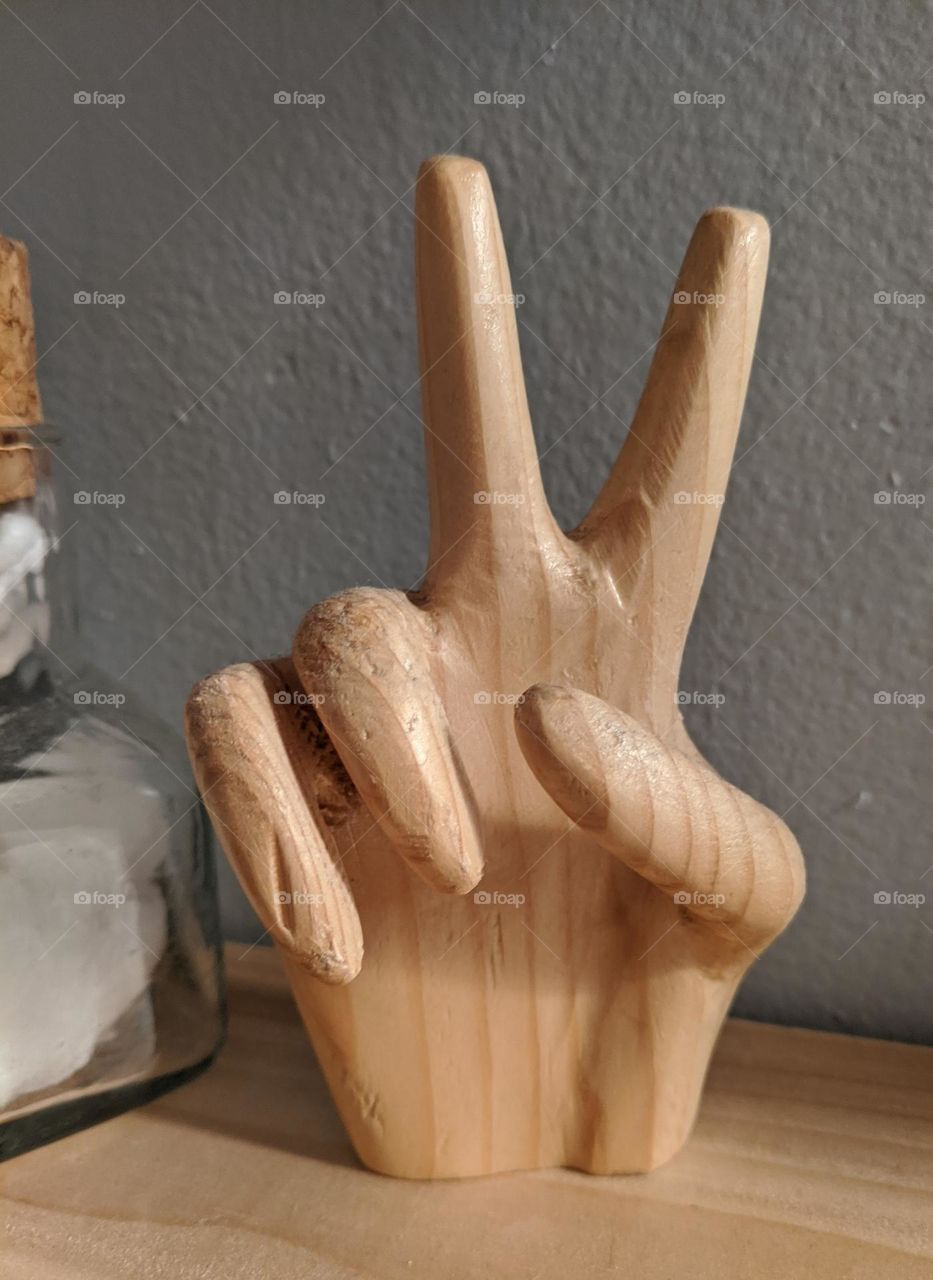 wooden peace sign hand all you need is love