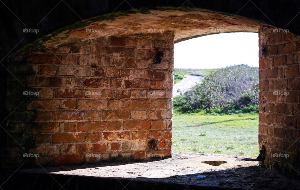 Looking at the view through a brick window