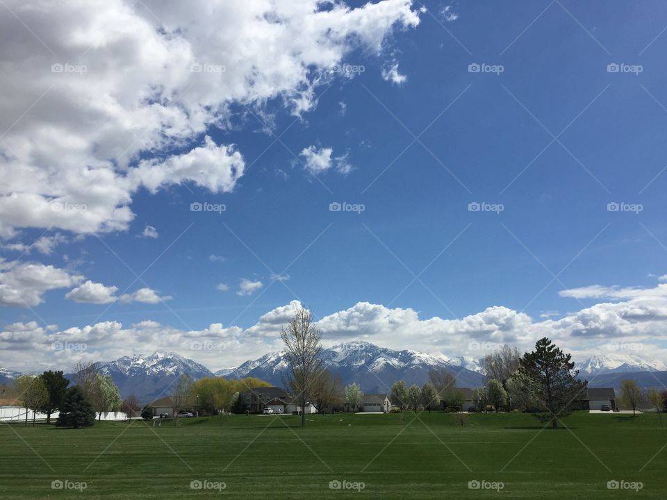 White Clouds & Sideways Triangle Blue Sky. 