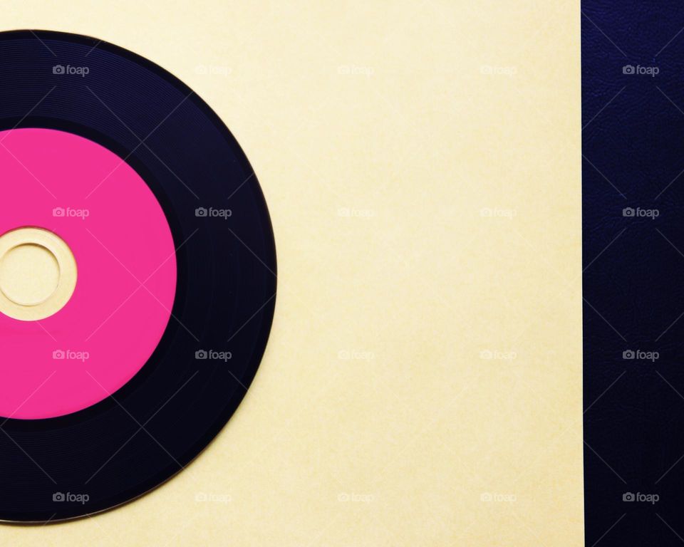 Yellow and pink vinyl disc background 
