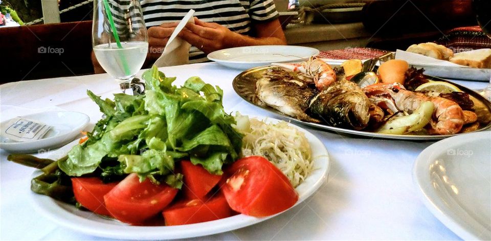 Lunch. Grilled shrimps and fish meal