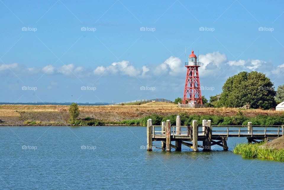 red lighthouse in the harbour