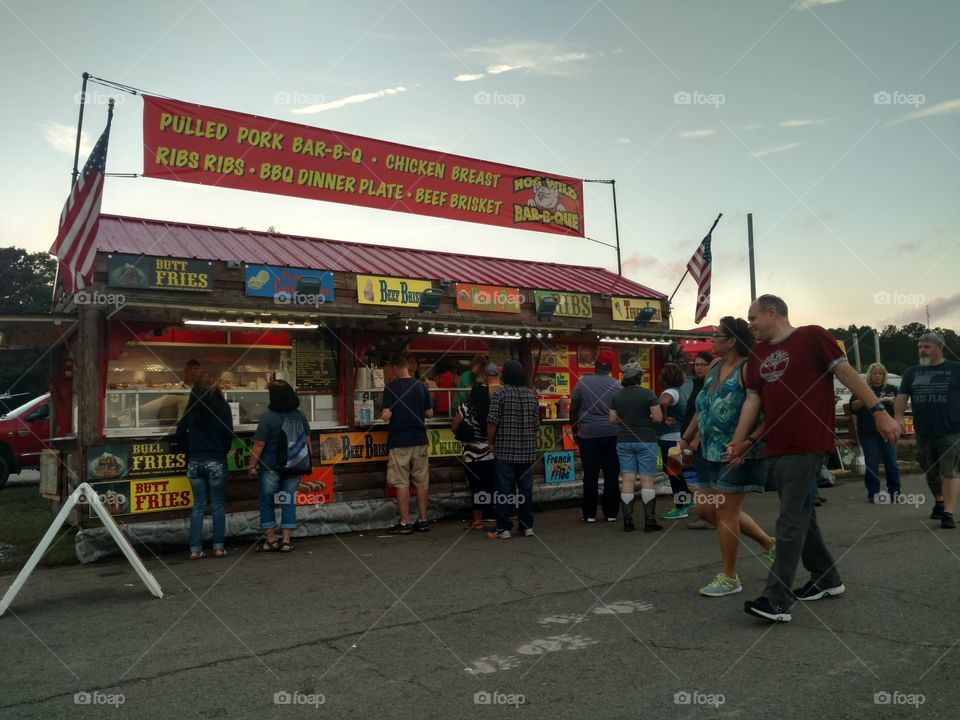 food cart at state fair with people passing by