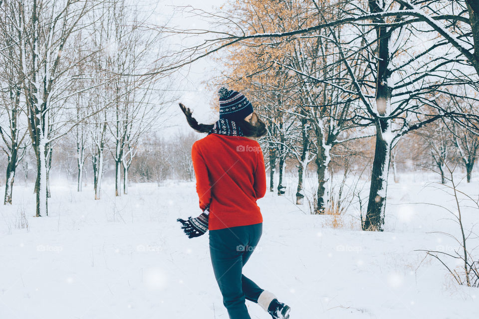 Girl on snowy landscape during autumn