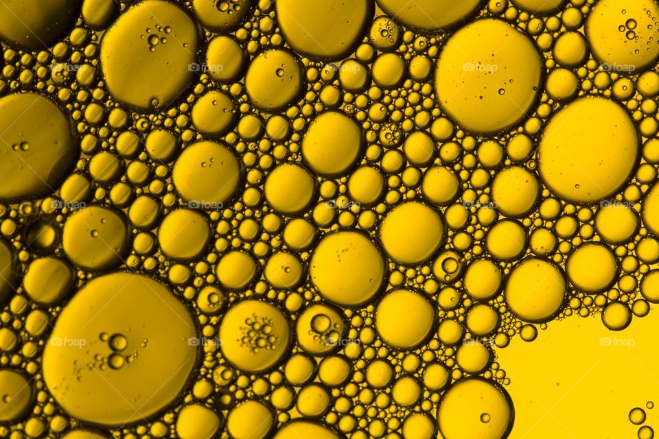 Abstract background of an oil bubbles on water surface