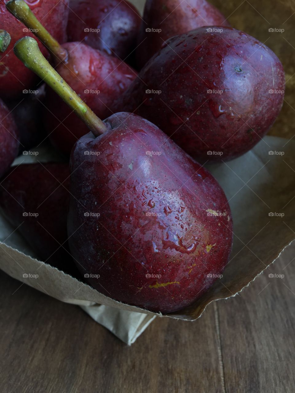 Red pear on the wooden table