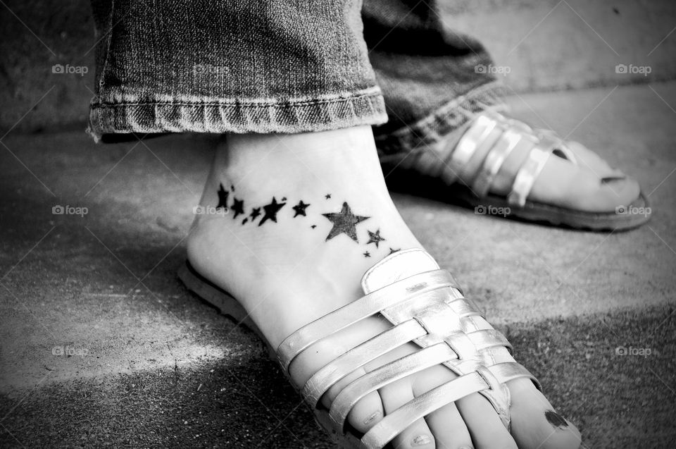 Beautiful feet with star tatto
