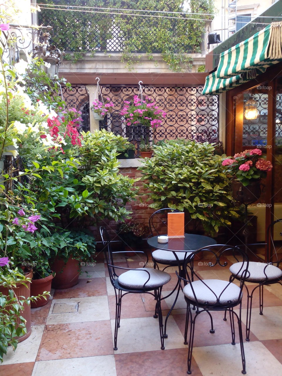 Coffee Spot in Venice. Pocket-garden  in Hotel La Fenice et des Artistes, Venice..Great place for coffee after  a day's walk-about