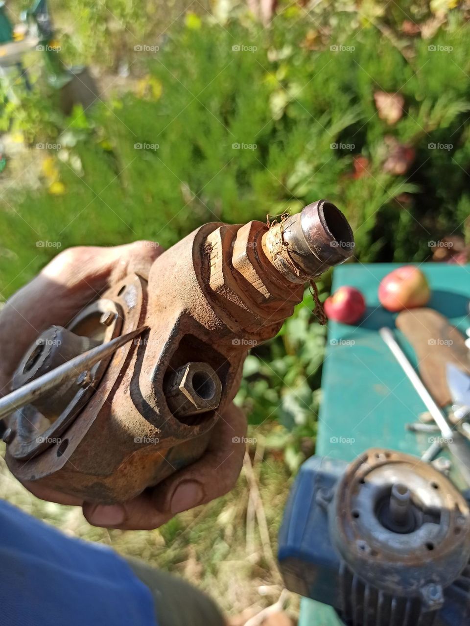a mechanic's hands as they work on a specific car repair