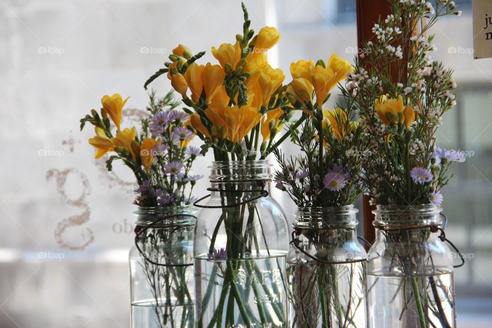 Yellow flowers in jar