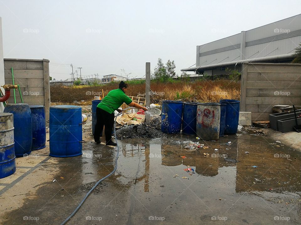 the woman cleaning trash