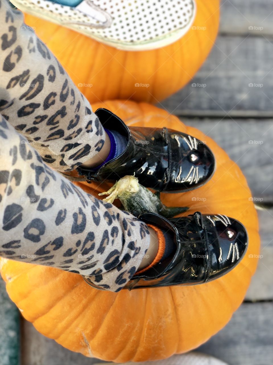 Pumpkins make a great foot rest for a hayride 
