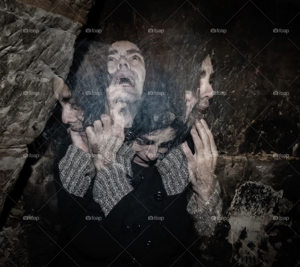 Fear & Torment - long exposure image, with 4 flash firings capture the torn anguish of this man