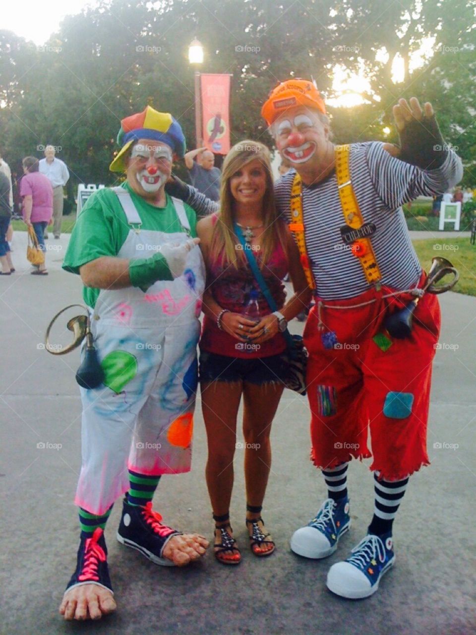 Portrait of men in face paint standing with young woman