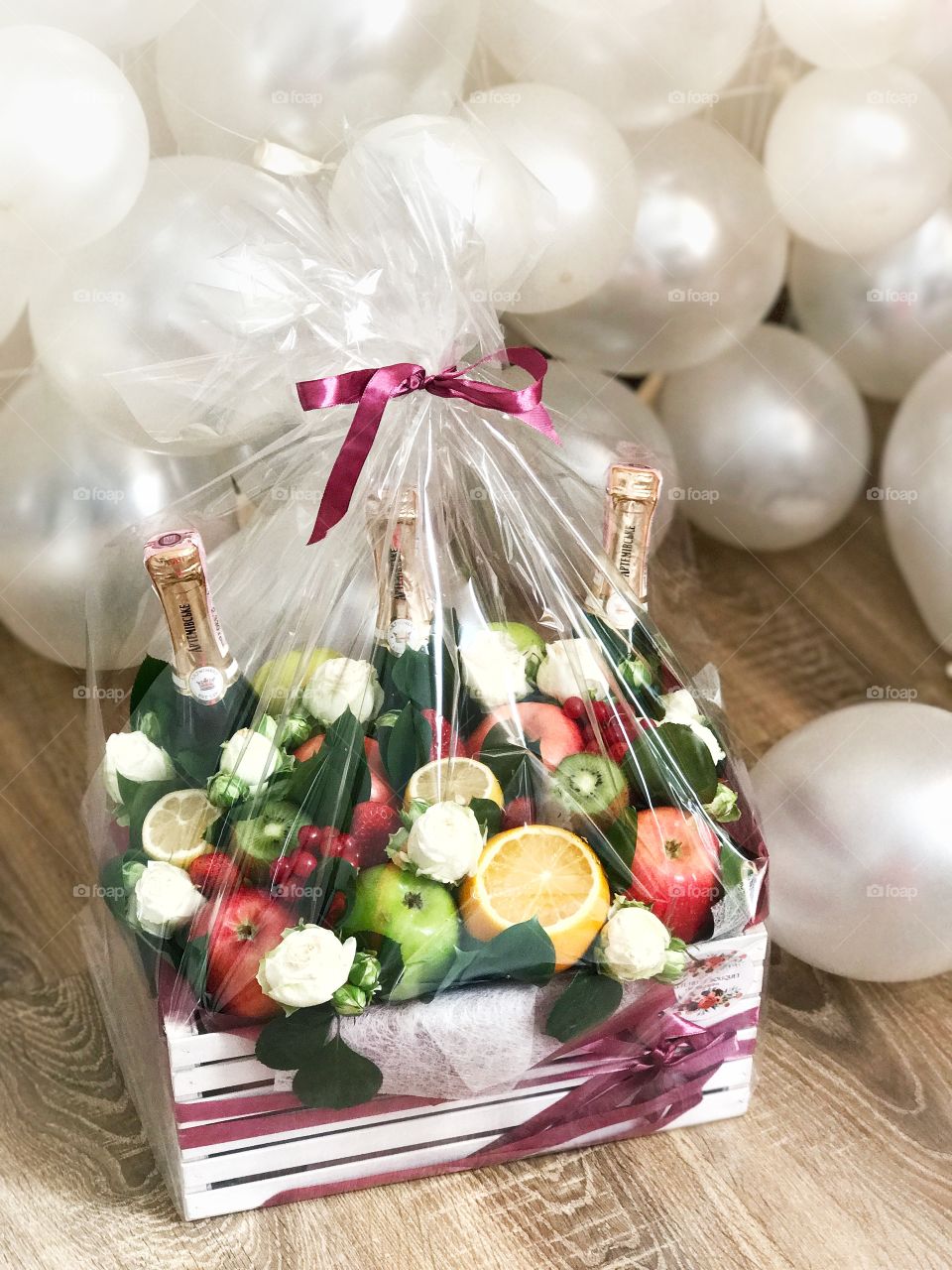 Gift box with fruits and champagne