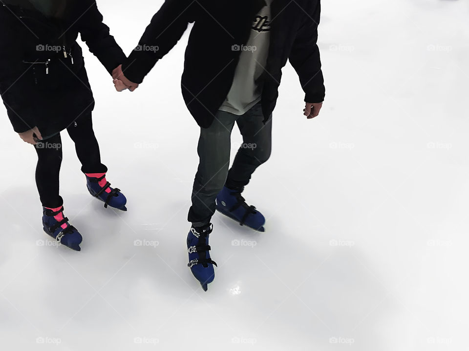 Couple on skating rink 