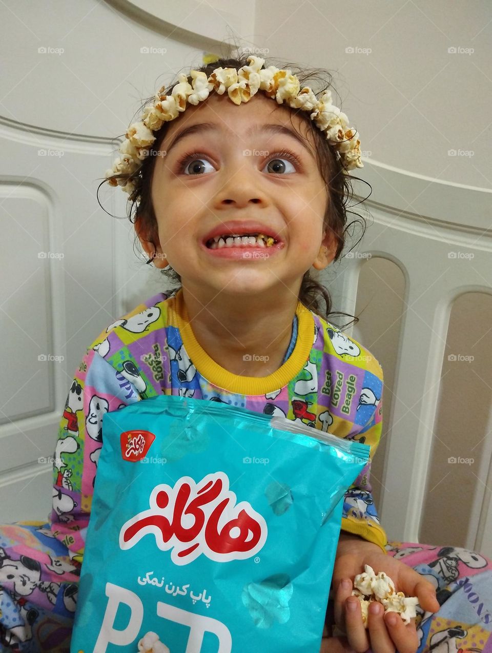 Very energetic cute boy suggests popcorn to all