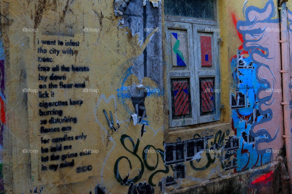 colorful graffiti on the wall near rectangular old window