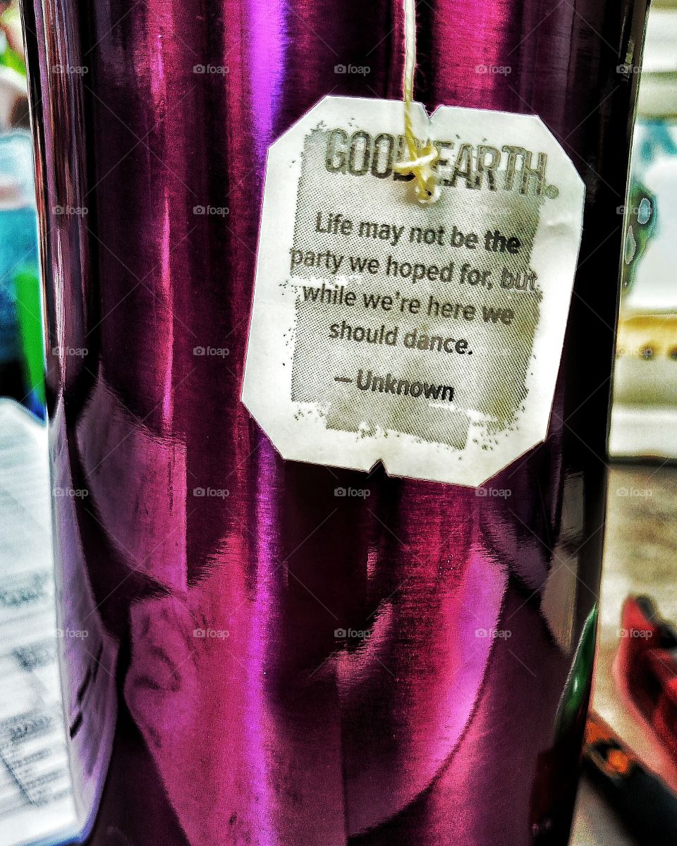 Purple travel mug and tea wisdom.