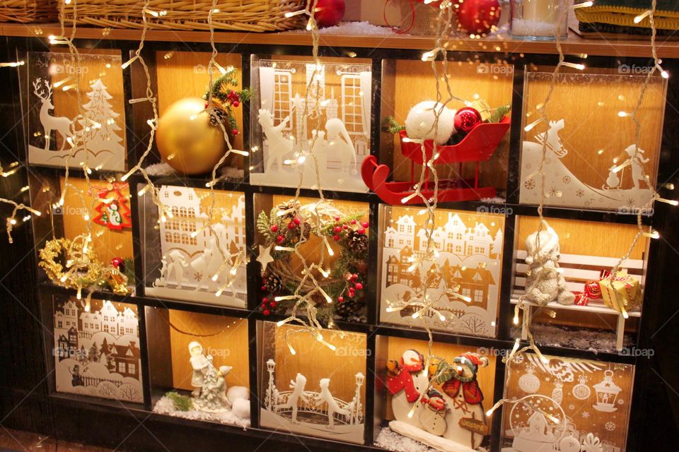 Happy New Year and Merry Christmas. Christmas decorations. Fir branches, shiny balls, garlands, lights and lanterns. gingerbread, dried fruits, nuts. Preparing for Christmas at home and on the streets.