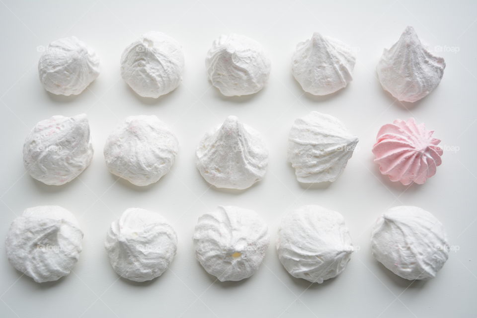 sugar meringues on a white background top view beautiful texture