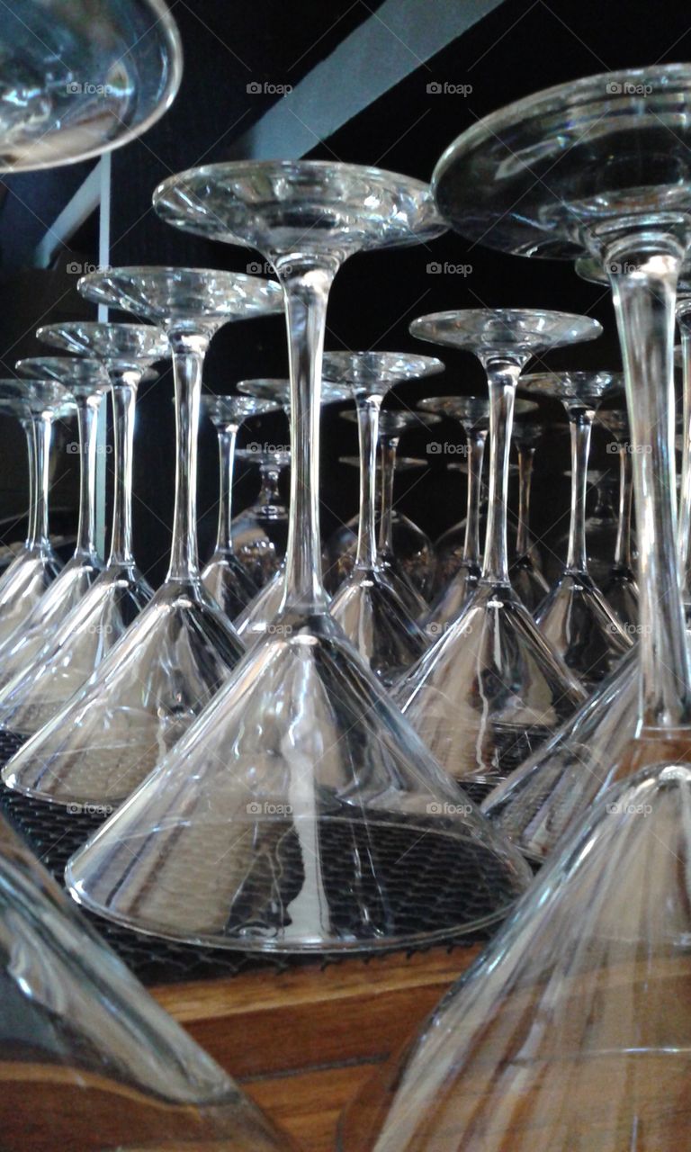 Martini glasses ready to go..  The line up of these glasses shine on.