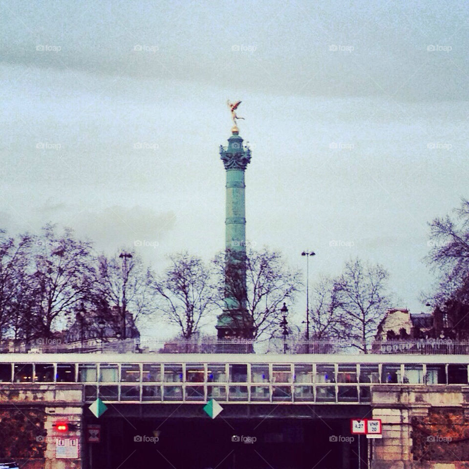 View of the monument of place de la Bastille seen from the canal.