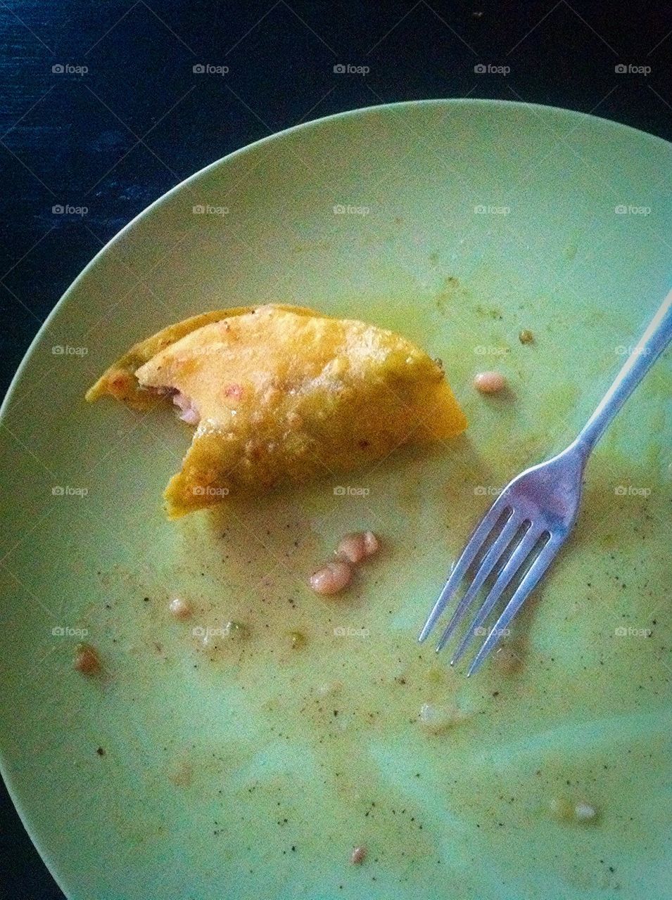 Taco . Last bite of a pork taco