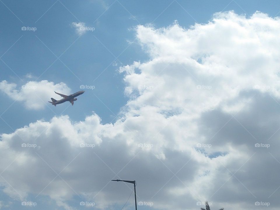 Beautiful flying airplane cross the sky