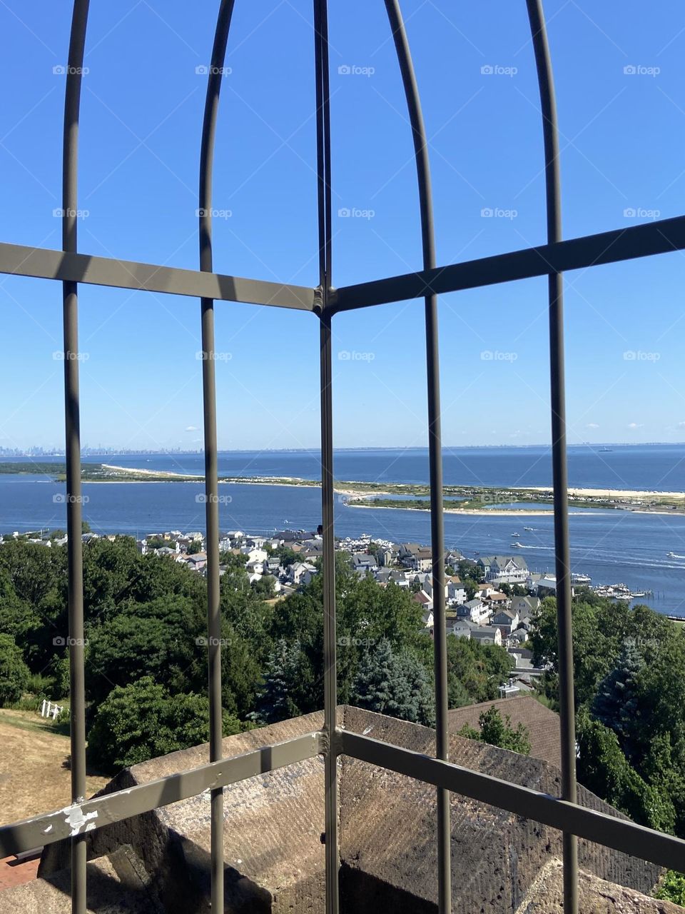 A view of the water from the “almost top” of one of two lighthouses at the Twin Lights Historic Site in Atlantic Highlands, NJ. The site overlooks the Shrewsbury River, Sandy Hook, Raritan Bay, the Atlantic Ocean, and the New York City skyline. 