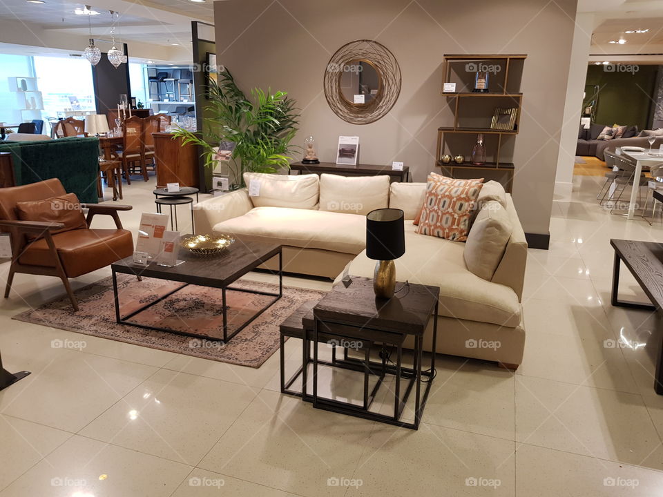Lining room with sofas chairs and coffee table at Peter Jones Sloane square Chelsea King's road London
