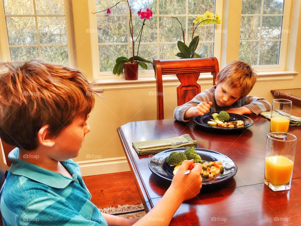 Young Boys Eating Supper