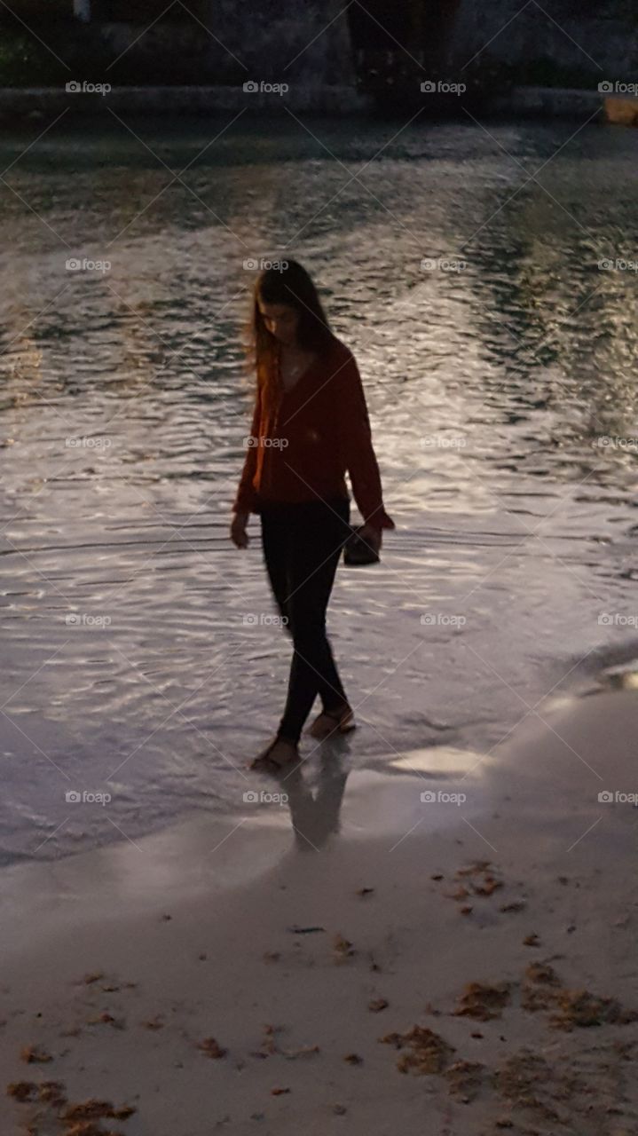 walking on beach at sunset