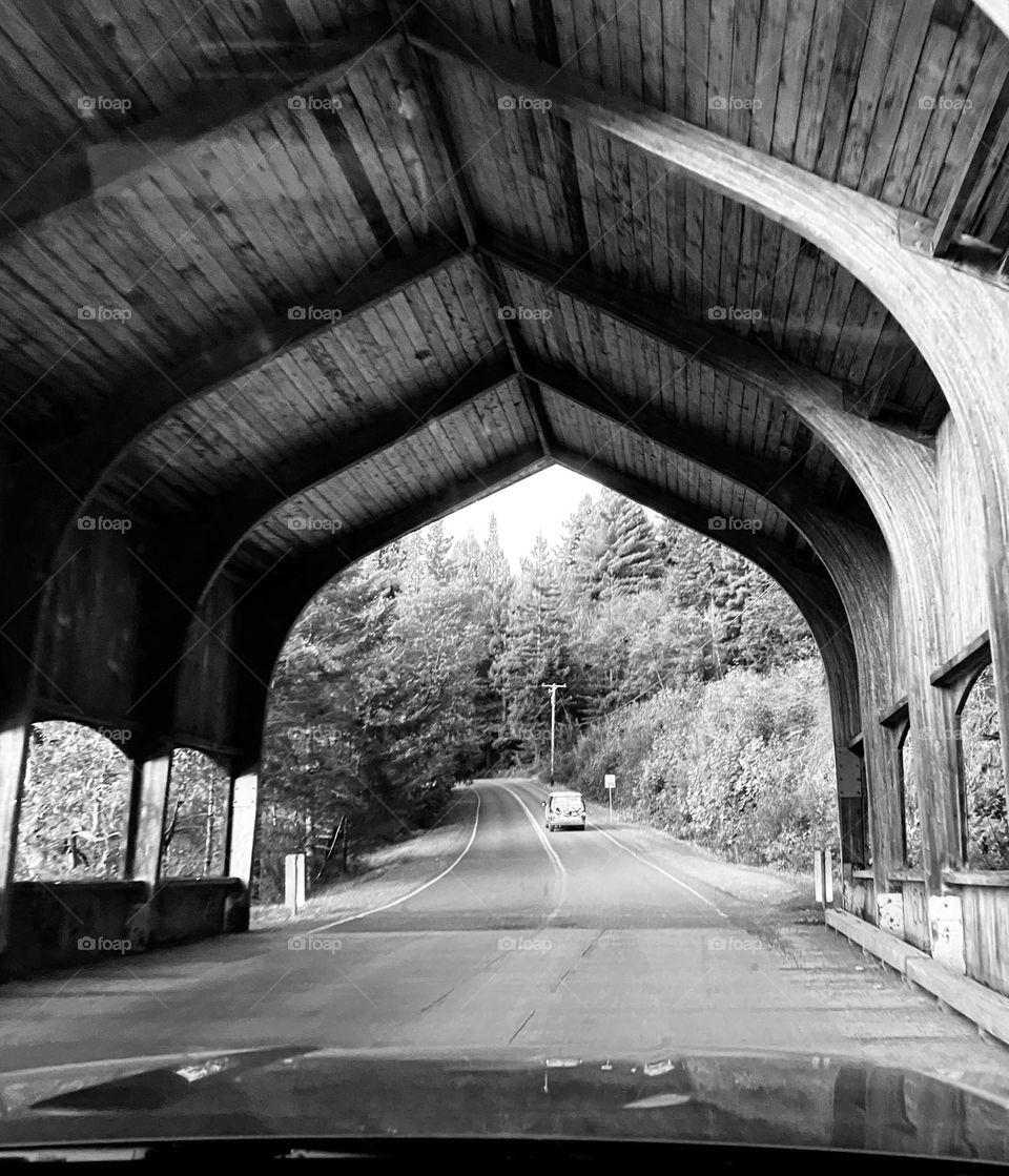 A wooden structure shades a bridge