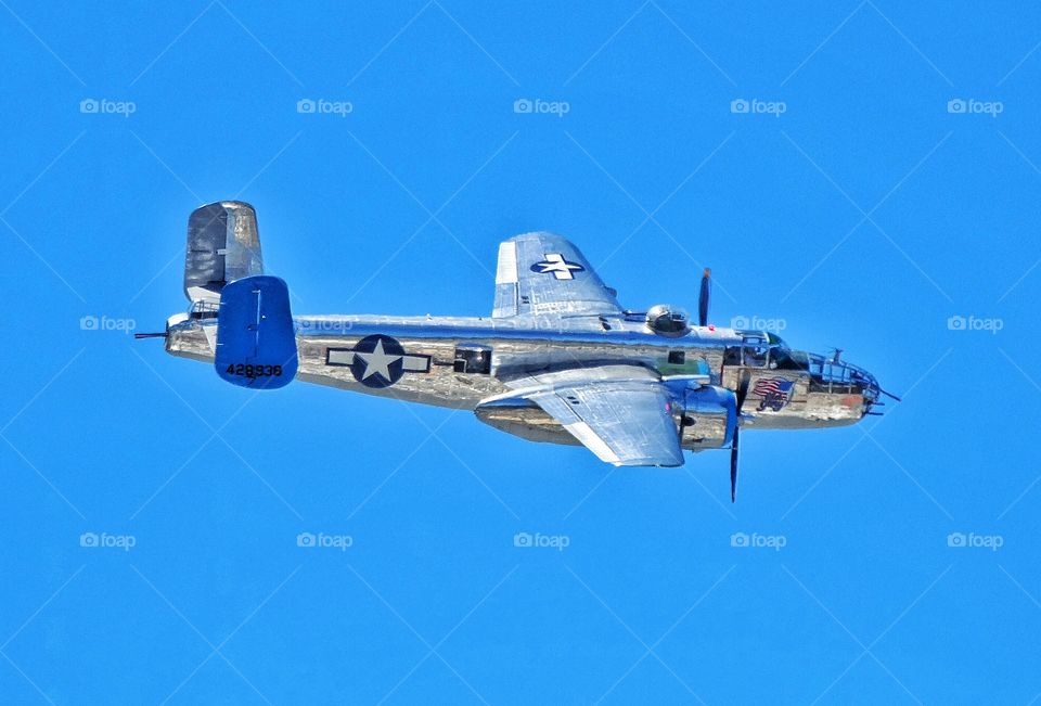 World War 2 Bomber Aircraft. Vintage World War II B-25 Mitchell Bomber Aircraft In Flight