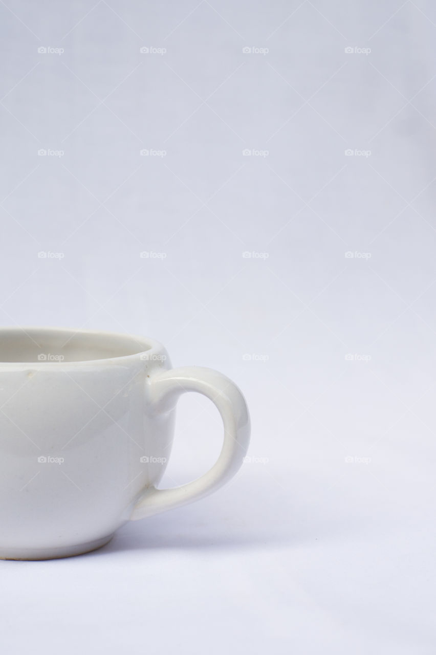 White cup with a white background