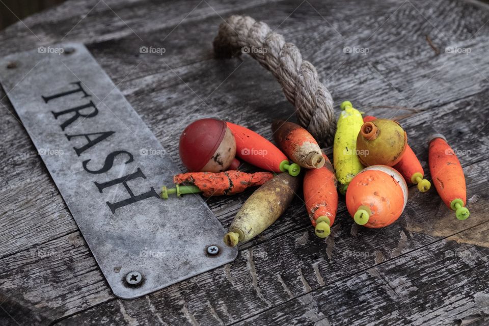 A colorful array of old abandoned fishing bobbers or floats picked along the shore of the millpond at Yates Mill County Park in Raleigh North Carolina. 