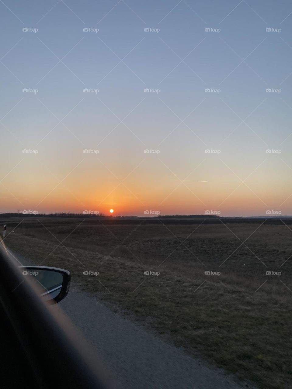 Beautiful view of the sunset over the fields on the way to Novi Sad