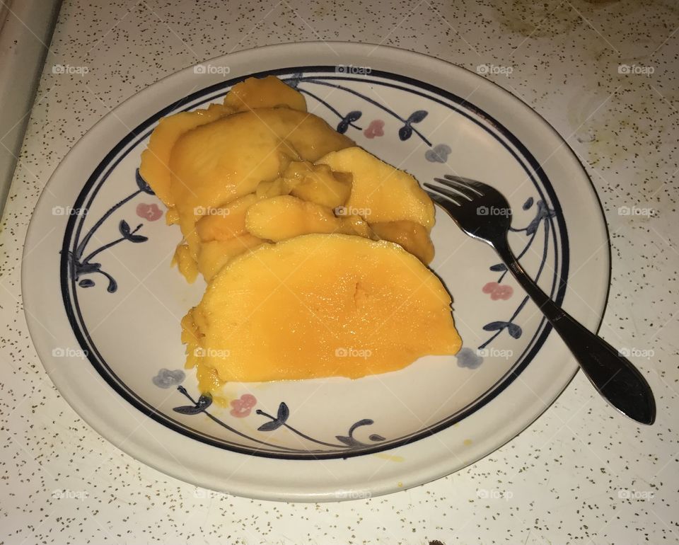 Cut-up mango for dessert after dinner. This fruit certainly makes quite a healthy dessert. It contains natural sweet and is refreshing when consumed.