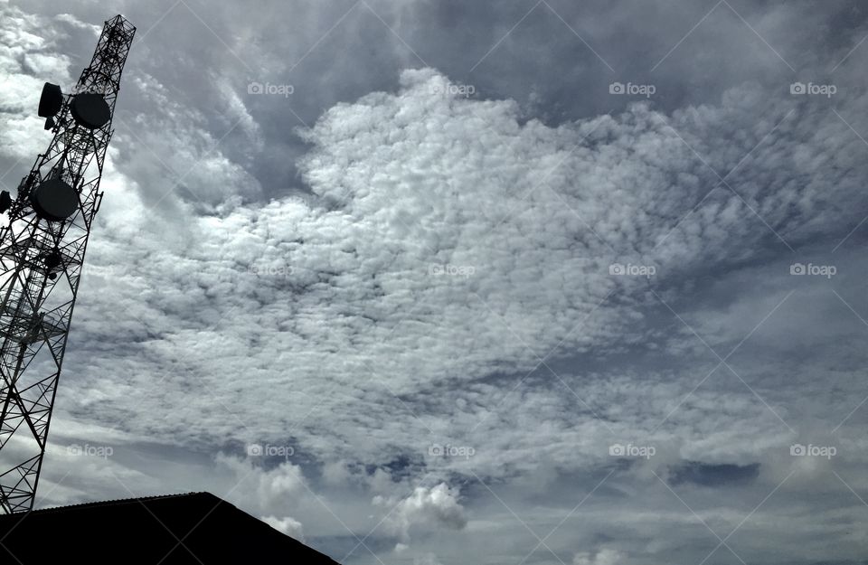 Clouds on the side of a network tower by rajonzx