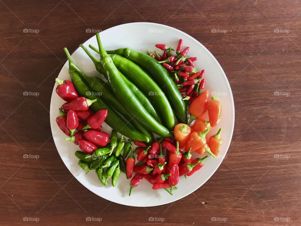 Plate full of various hot chillies 