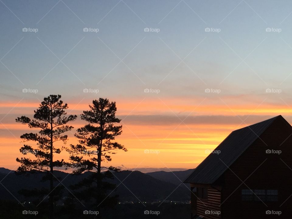 This sunset show the day fading into the brightly-lit town of Pigeon Forge in the gorgeous Smokey Mountains 
