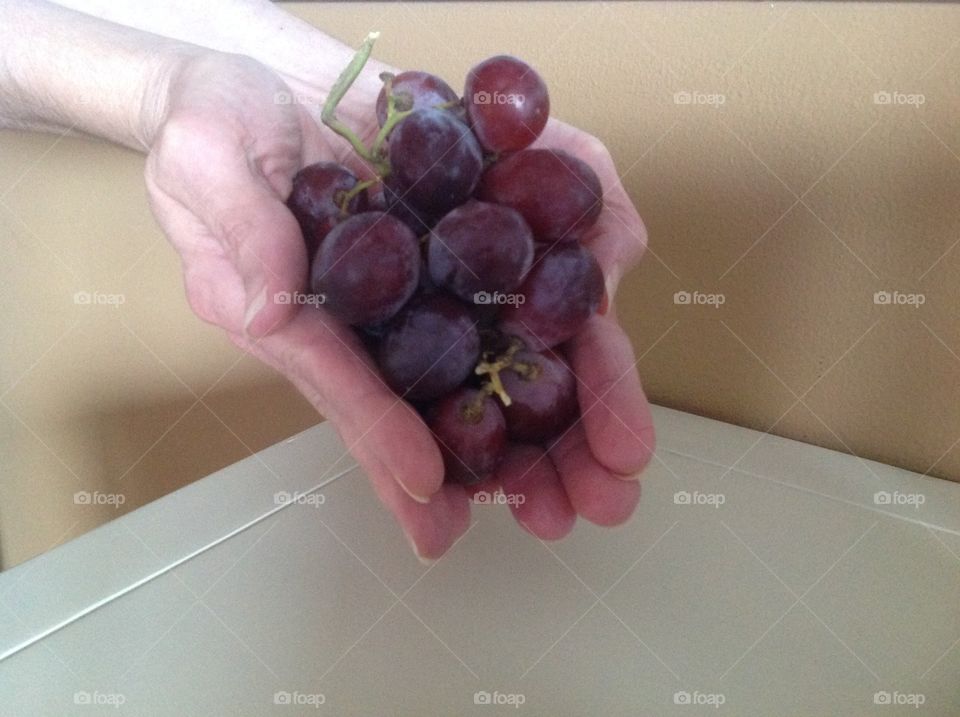 A handful of juicy red grapes.