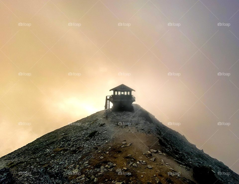 Waiting for the clouds to part for an alpine sunset at the fire lookout on Mount Rainer National Park 