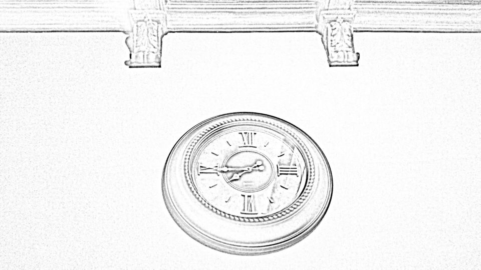 A wall clock in the shape of a drawing