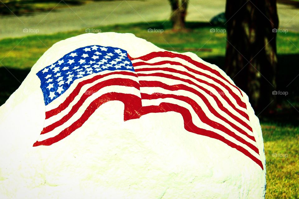 American flag painting (huge white rock)