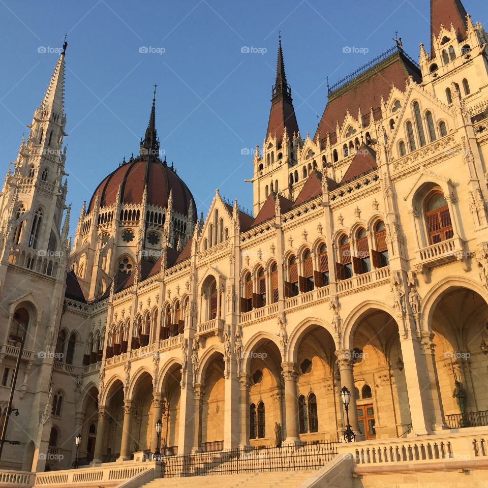 Parliament Building . the stunning Parliament building in Budapest  looking even more breathtaking in the golden light of the setting sun 